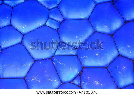 BEIJING - DECEMBER 14: The National Aquatics Center, the water cube, located in gym plaza lights up for celebrating the nearby community anniversary on December 14, 2009 in Beijing, China