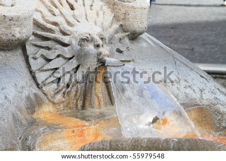 Rome: running water from sun king sculpture of Fontana della Barcaccia of Piazza di Spagna, just below the Spanish Steps
