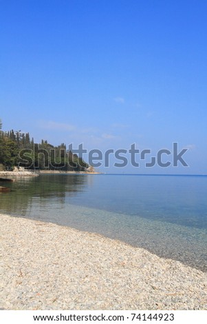crystal clear Lake Garda and the shore at Sirmione - Lake Garda is the largest lake of Italy
