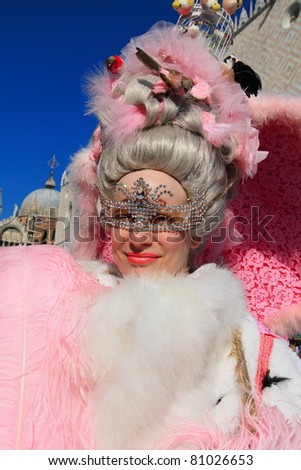 VENICE, ITALY - FEBRUARY 26: Masked lady greets visitors at the annual Venice Carnival festival on February 26, 2011 in Venice, Italy.