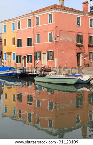 Venice: traditional colorful houses along the canal of Burano Island, Italy