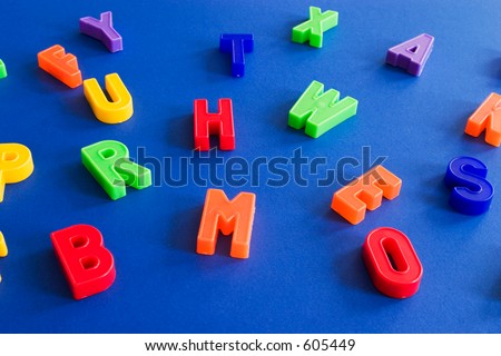 plastic colored letters on blue background