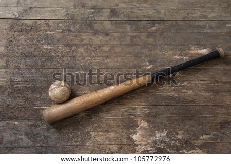 baseball bat and ball on old weathered floor