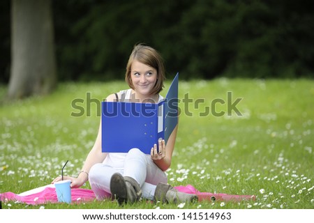 young female student in the  park