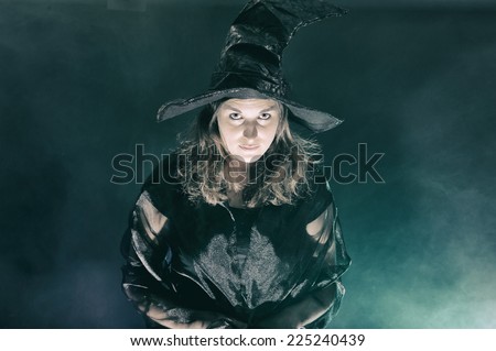 Halloween witch on smoke green and purple background
