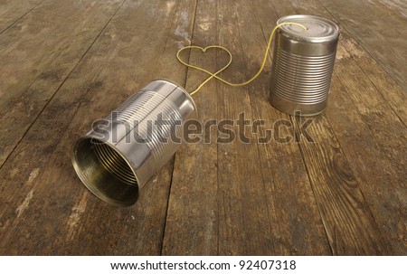 tin can phone with heart shape in wire