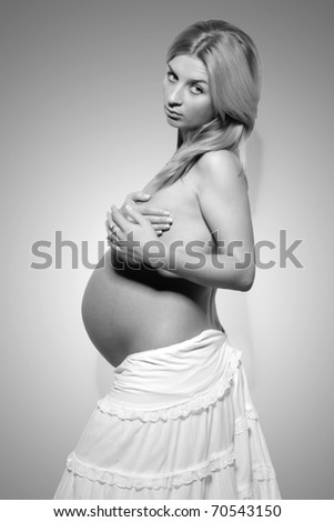 stock photo black white Pregnant nude woman standing in profile and 