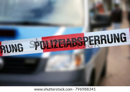 Cordon tape with the word „Polizeiabsperrung“, the german word for police cordon