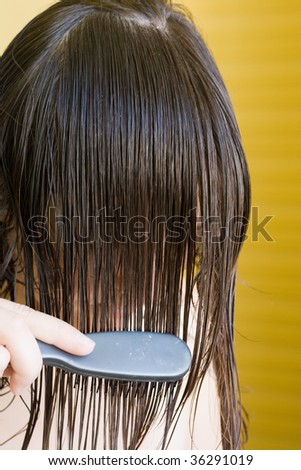girl combing her hair