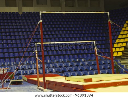 Professional gymnastic uneven bars in sport palace