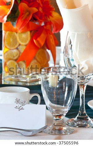  of a wedding table place setting with colorful centerpiece made up of