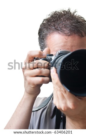 Looking into a telephoto lens, with a photographer behind, finger on the shutter, isolated on white.