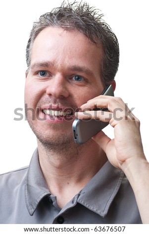 A man smiling, and talking on a flip phone, isolated on white.