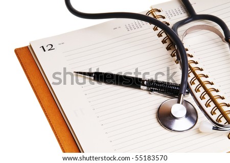 Notebook of doctor, pen and stethoscope
