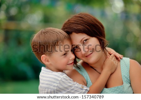 Portrait of an affectionate and loving mother kissing her baby son