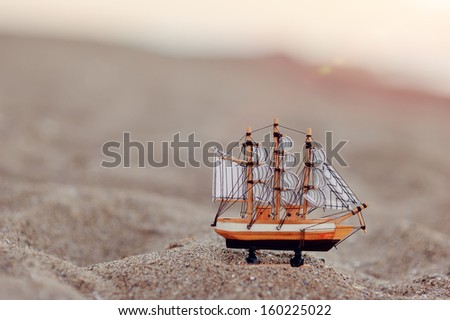 the sand is a beautiful layout of wood sailing ship