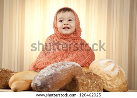 baby girl eating bread