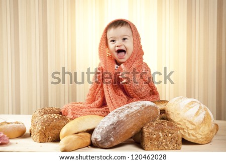 baby girl eating bread