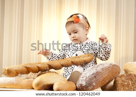 baby eating bread