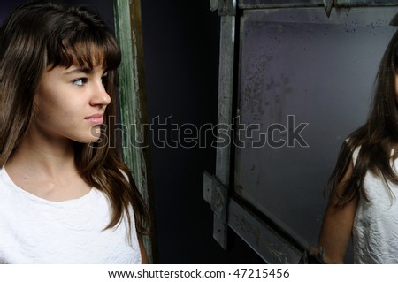 young model looking in mirror