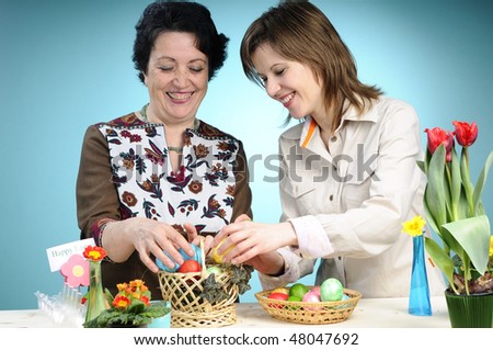 two adults selecting easter eggs