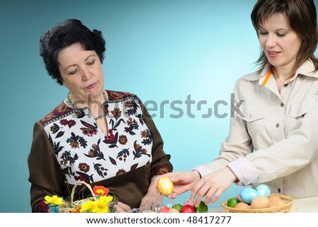 people decorating easter table