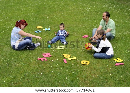 happy family playing in park