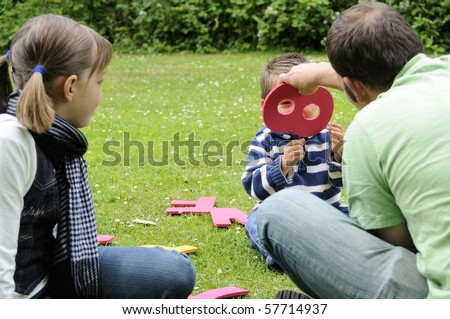 happy family playing in park