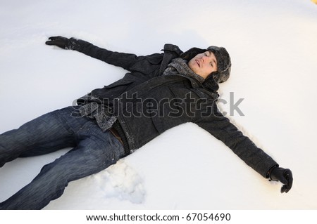 man making snow angel