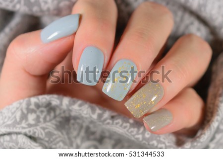 beautiful manicure. Gel polish coating in blue