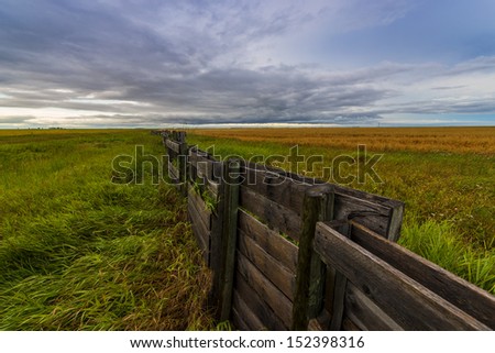 Cloudy Landscape with a fence