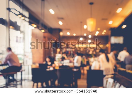 Blur coffee shop  or cafe restaurant with abstract bokeh light image background. For create  montage product display