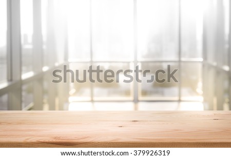 Empty the top of wood table with  blur  sunlight in window building.background.for product display