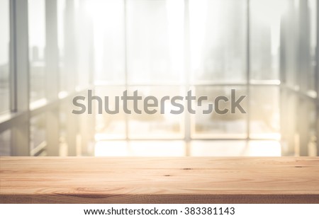 Empty the top of wood table with  blur  sunlight in window building.background.for product display and presentation