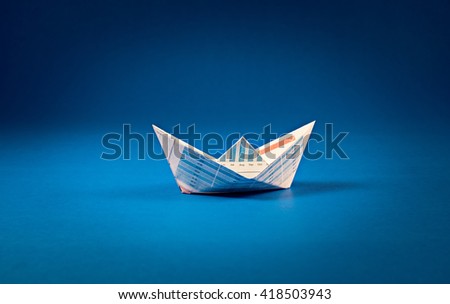 Boat paper graph on blue ocean .Business goal concept