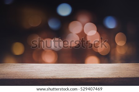 Empty of wood table top with blurred light gold bokeh abstract background.For montage product display or design key visual layout