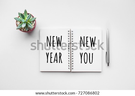 New year new you text on notepad with office accessories.Business motivation,inspiration concepts