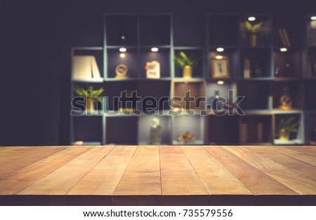 Real wood table top texture on dark room interior design background.For create product display or design key visual layout