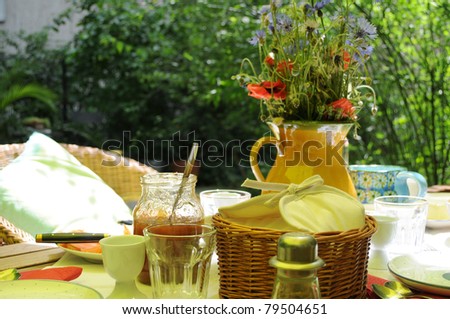 Summer Brunch - Breakfast table on a hot summers day in the shadow