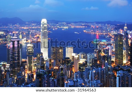 Thousand of skyscraper on two side of Victoria Harbour of Hong Kong. View from the Peak at evening.