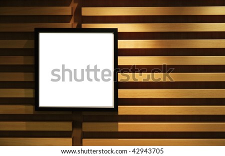 Black picture frame on a contemporary designed wall with striped wood.