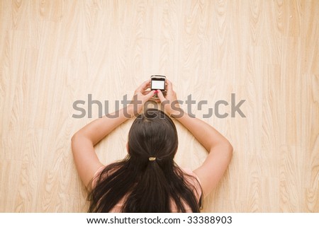 overhead shot of woman using a mobile device