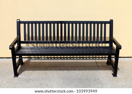 Empty metal bench in sunshine