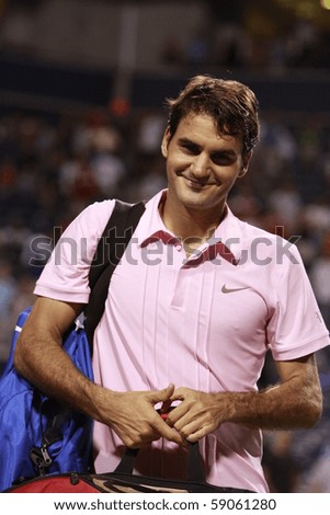 TORONTO: AUGUST 14. Roger Federer greets fans after he won a tournament with Novak Djokovic  in the Rogers Cup 2010 on August 14, 2010 in Toronto, Canada.
