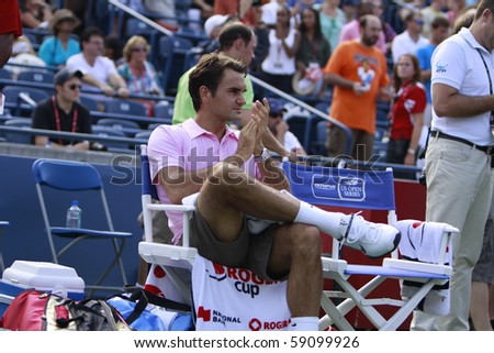 TORONTO: AUGUST 15.Roger Federer waits fro his price after tournament with Andy Murray  in the Rogers Cup 2010 finals on August 15, 2010 in Toronto, Canada.