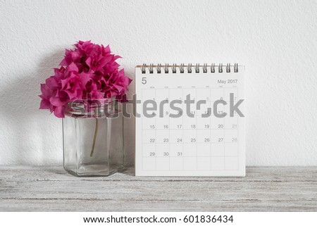 calendar may 2017 on wooden table in room