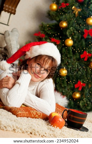 Christmas Woman. New Year and Christmas Tree santa claus hat.