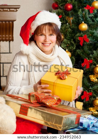 Christmas Woman. New Year and Christmas Tree santa claus hat.