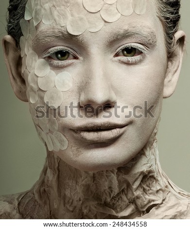 Woman model in the form of a snake. Fashion. Body painting.