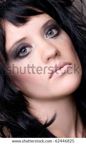 Sad woman face with smeared makeup